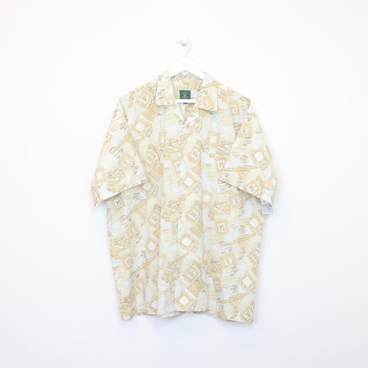 Vintage Men's Casuals Hawaiian shirt in beige. Best fits XL