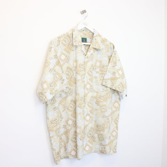 Vintage Men's Casuals Hawaiian shirt in beige. Best fits XL