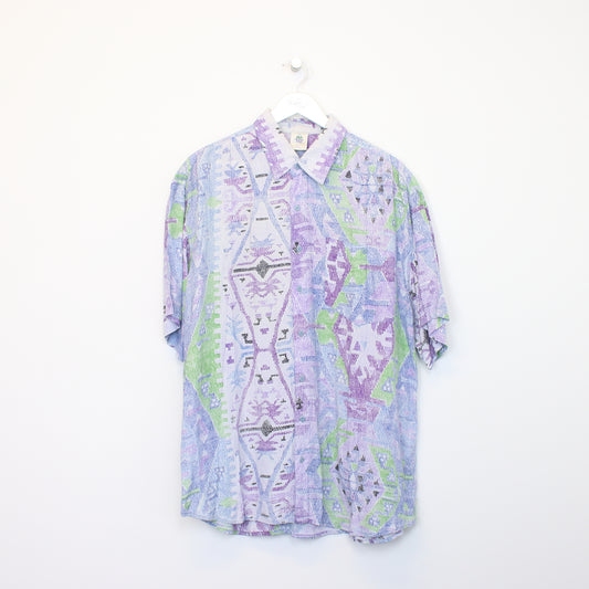 Vintage New Fast shirt in purple. Best fits L