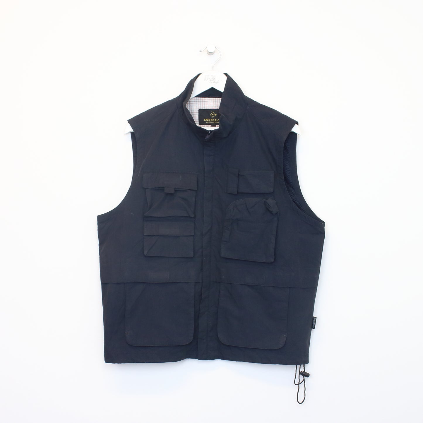 Vintage Dunlop vest in black. Best fits L