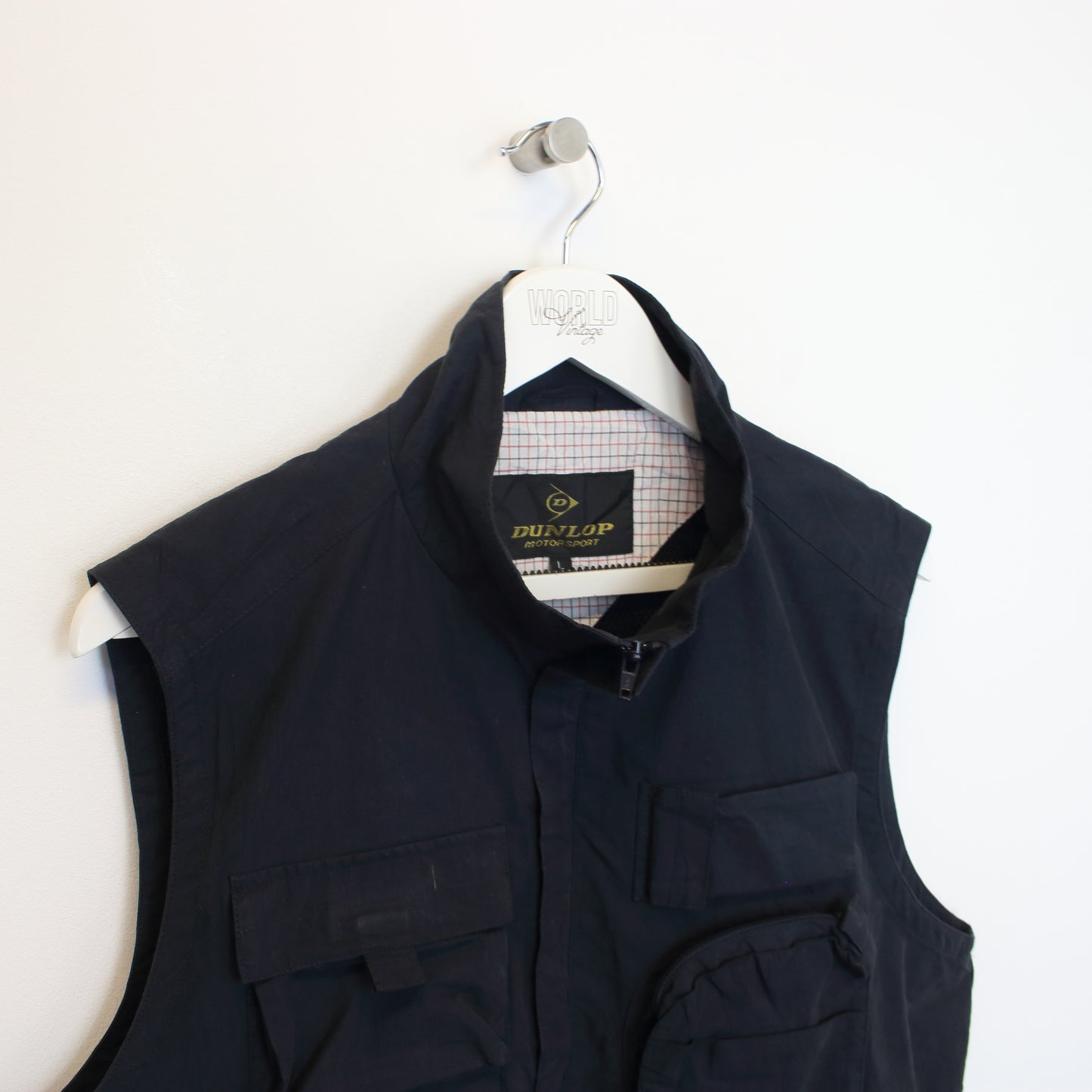 Vintage Dunlop vest in black. Best fits L