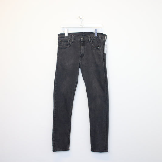 Vintage Levi's jeans in black. Best fits W30 L27
