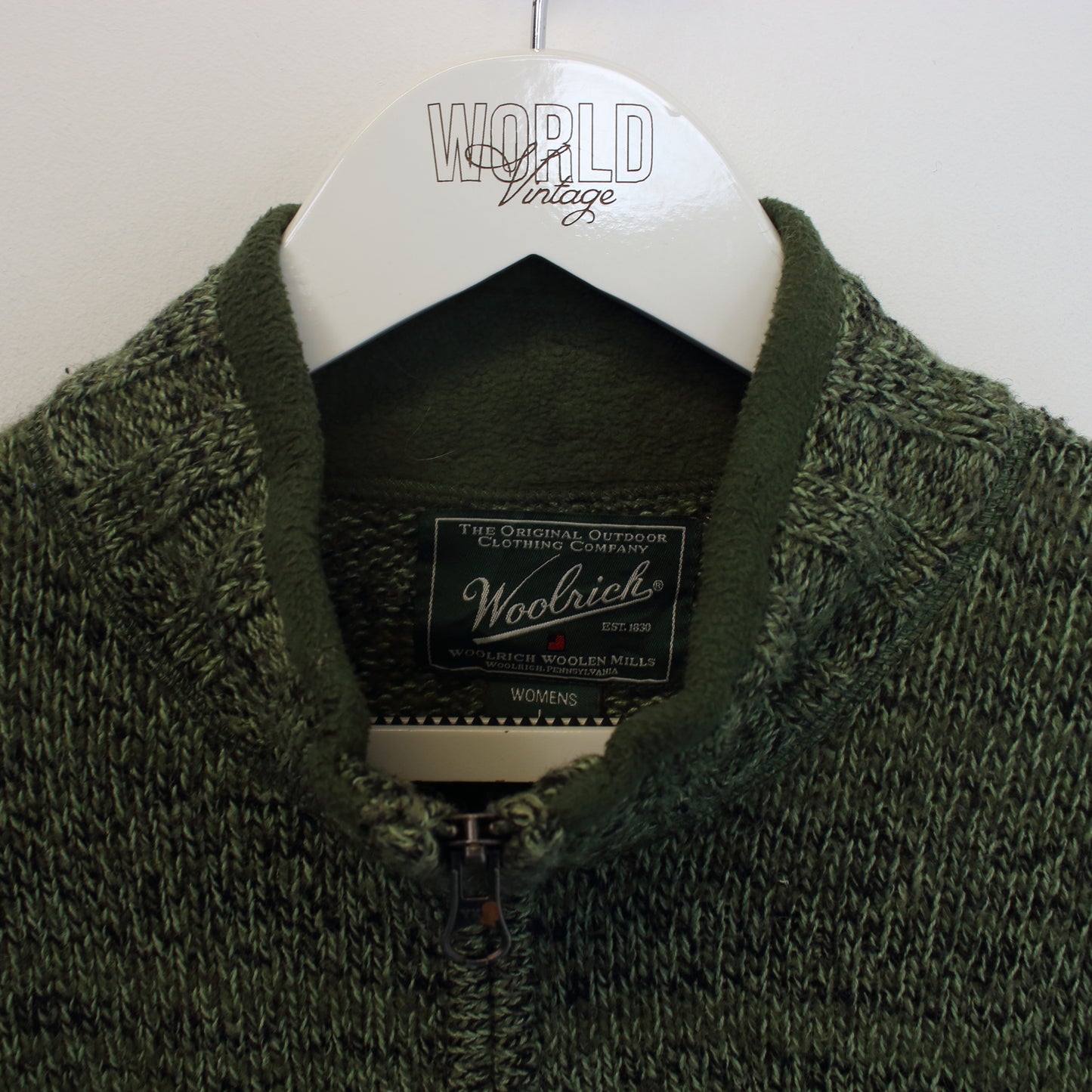 Vintage women's Woolrich knitted quarter zip sweatshirt in green. Best fits M