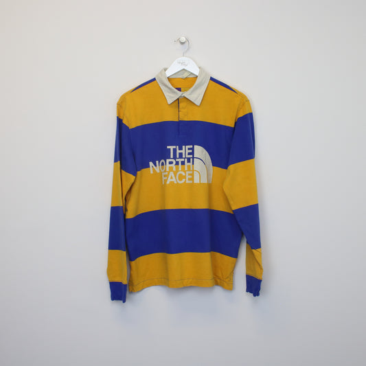 Vintage The North Face rugby shirt in blue and yellow. Best fits S