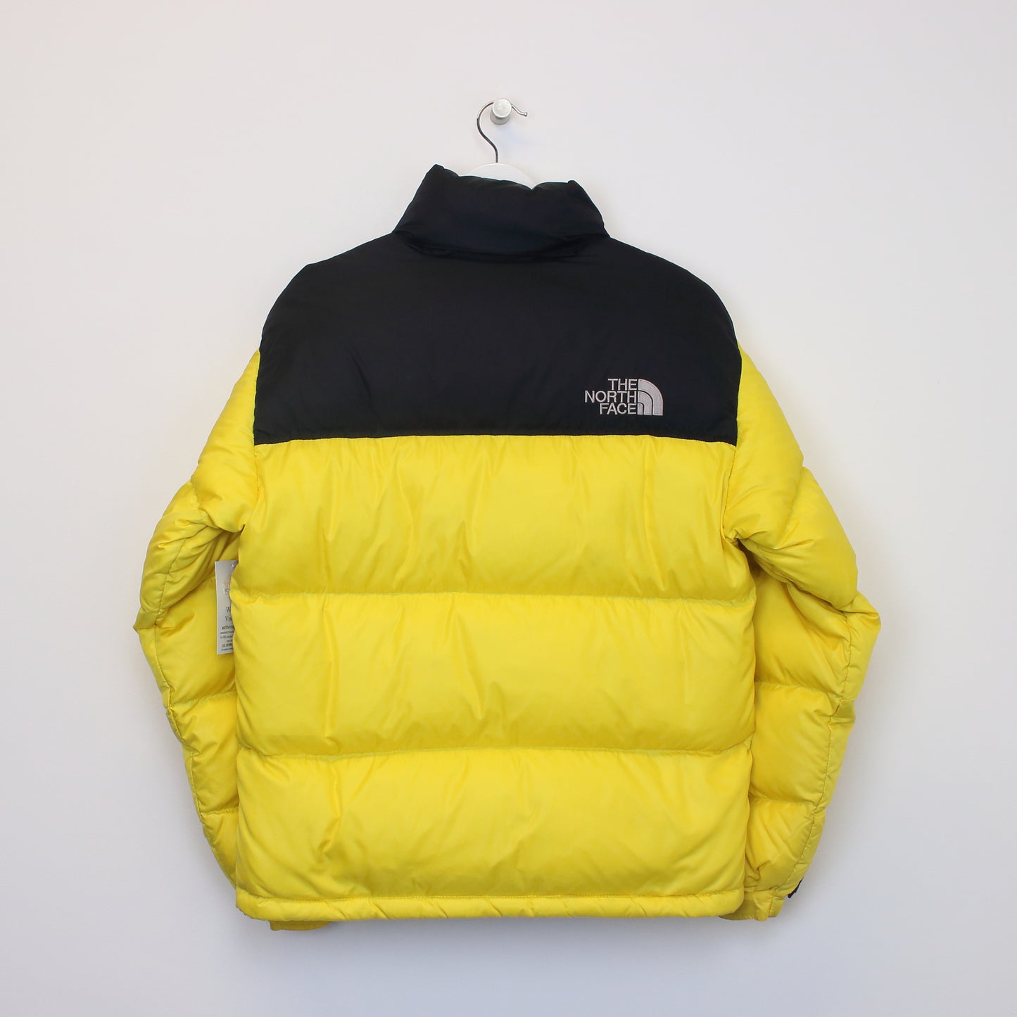 The North Face 700 nuptse series puffer jacket in yellow. Best fits S