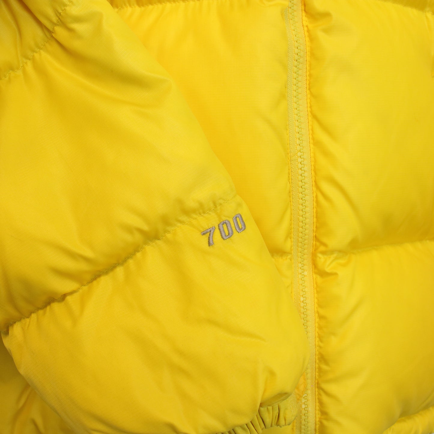 The North Face 700 nuptse series puffer jacket in yellow. Best fits S