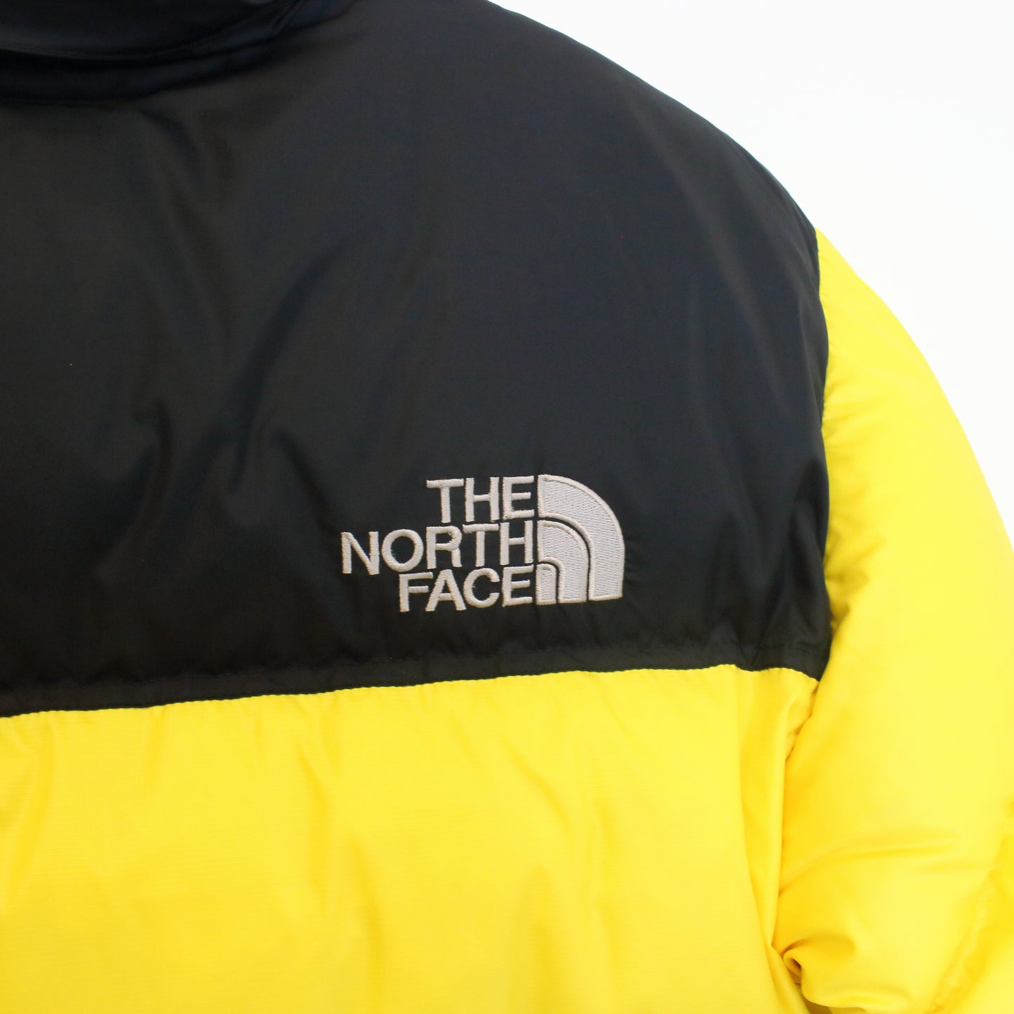 The North Face 700 nuptse series puffer jacket in yellow. Best fits S