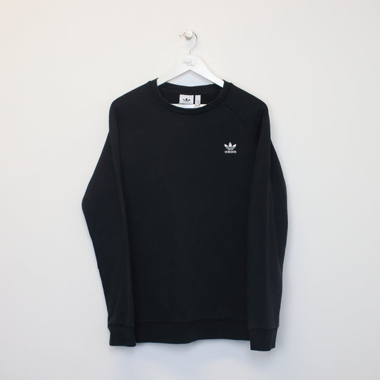 Vintage Adidas sweatshirt in black. Best fits L