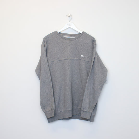 Vintage Adidas sweatshirt in grey. Best fits L