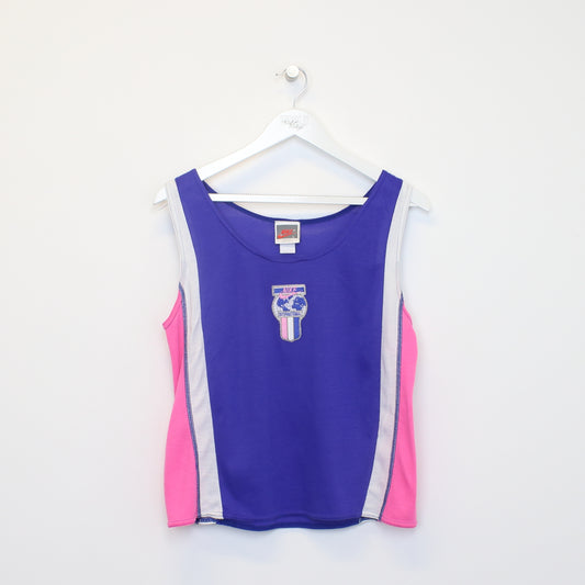 Vintage Women's Nike tank top in purple and pink. Best fits L