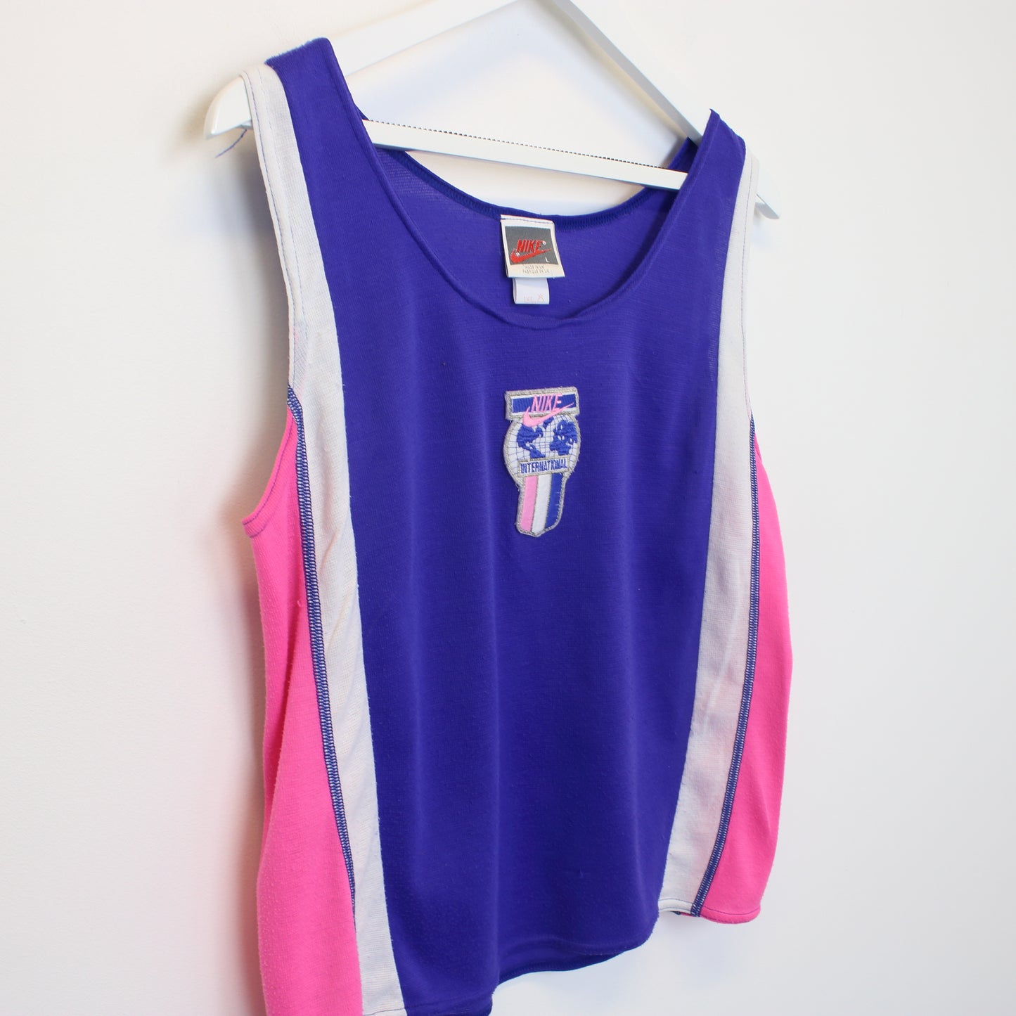 Vintage Women's Nike tank top in purple and pink. Best fits L