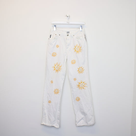 Vintage Iceberg jeans in white. Best fits W29