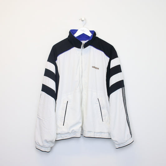 Vintage Adidas jacket in black and white. Best fits L