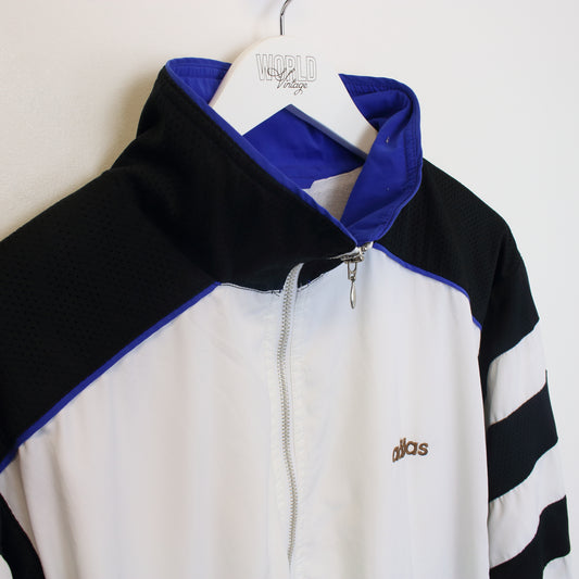 Vintage Adidas jacket in black and white. Best fits L