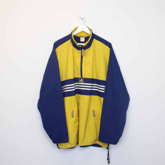 Vintage Adidas jacket in yellow and navy. Best fits XXXL