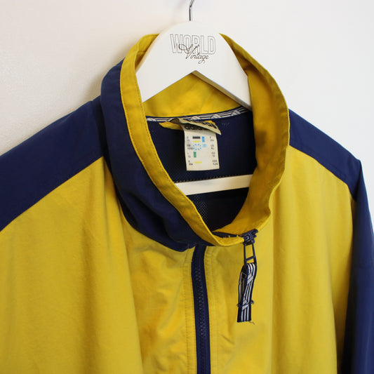 Vintage Adidas jacket in yellow and navy. Best fits XXXL