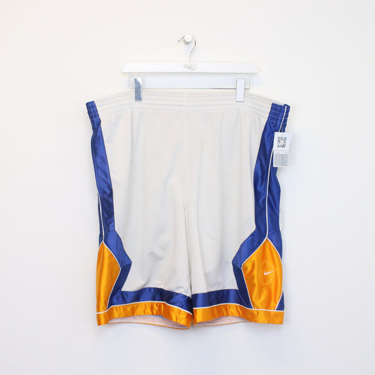 Vintage Nike shorts in white, blue, and yellow. Best fits XXL