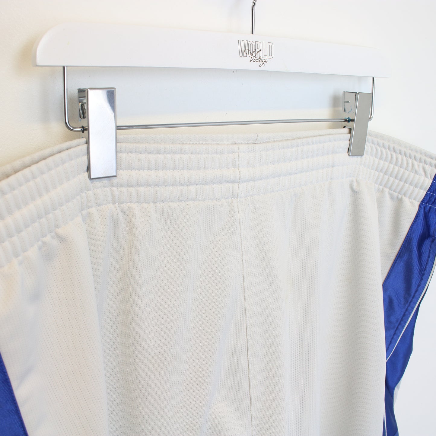 Vintage Nike shorts in white, blue, and yellow. Best fits XXL