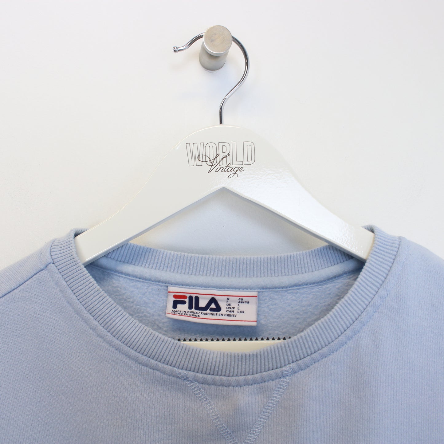 Vintage women's Fila sweatshirt in Blue. Best Fits S