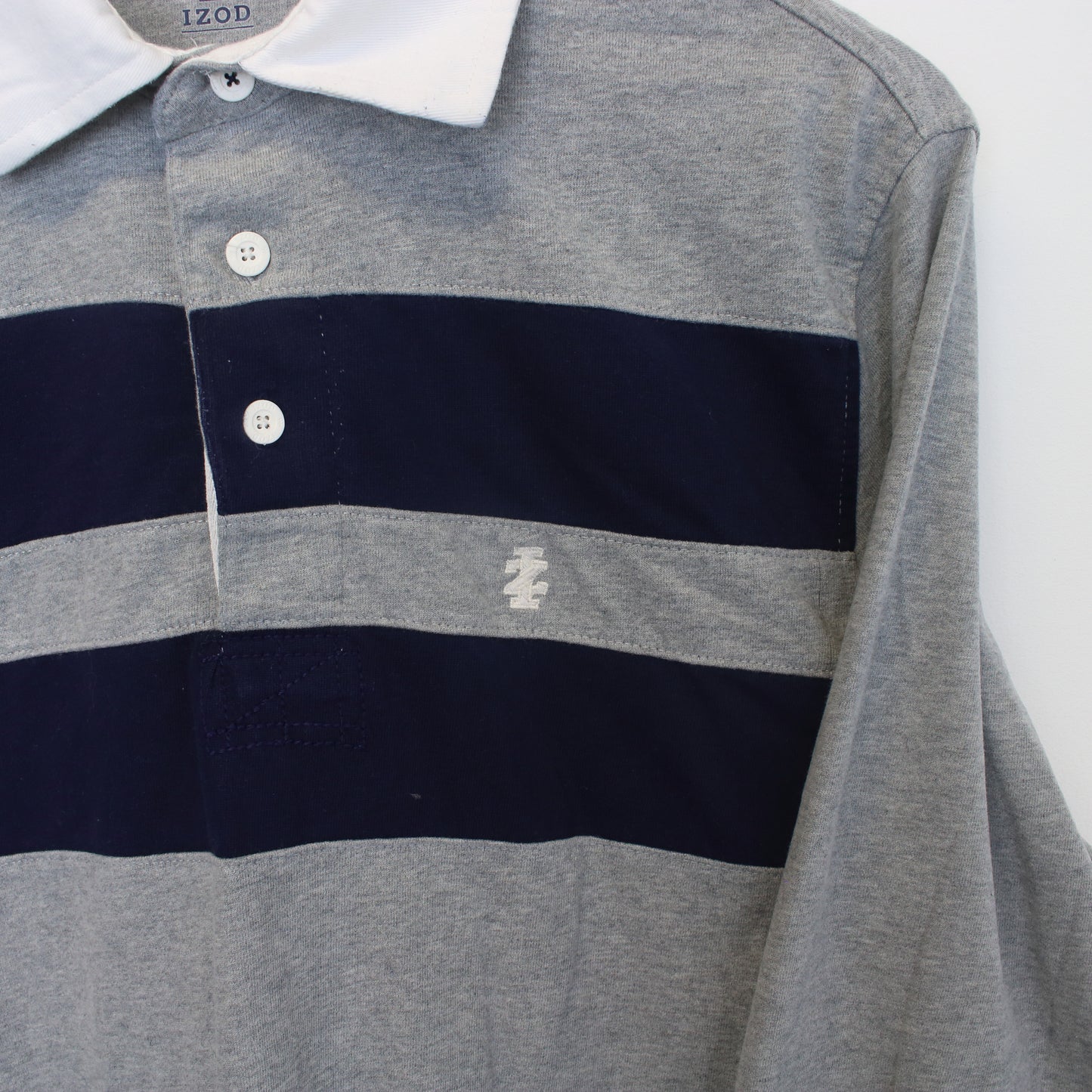 Vintage Izod rugby shirt in Navy and grey. Best fits S