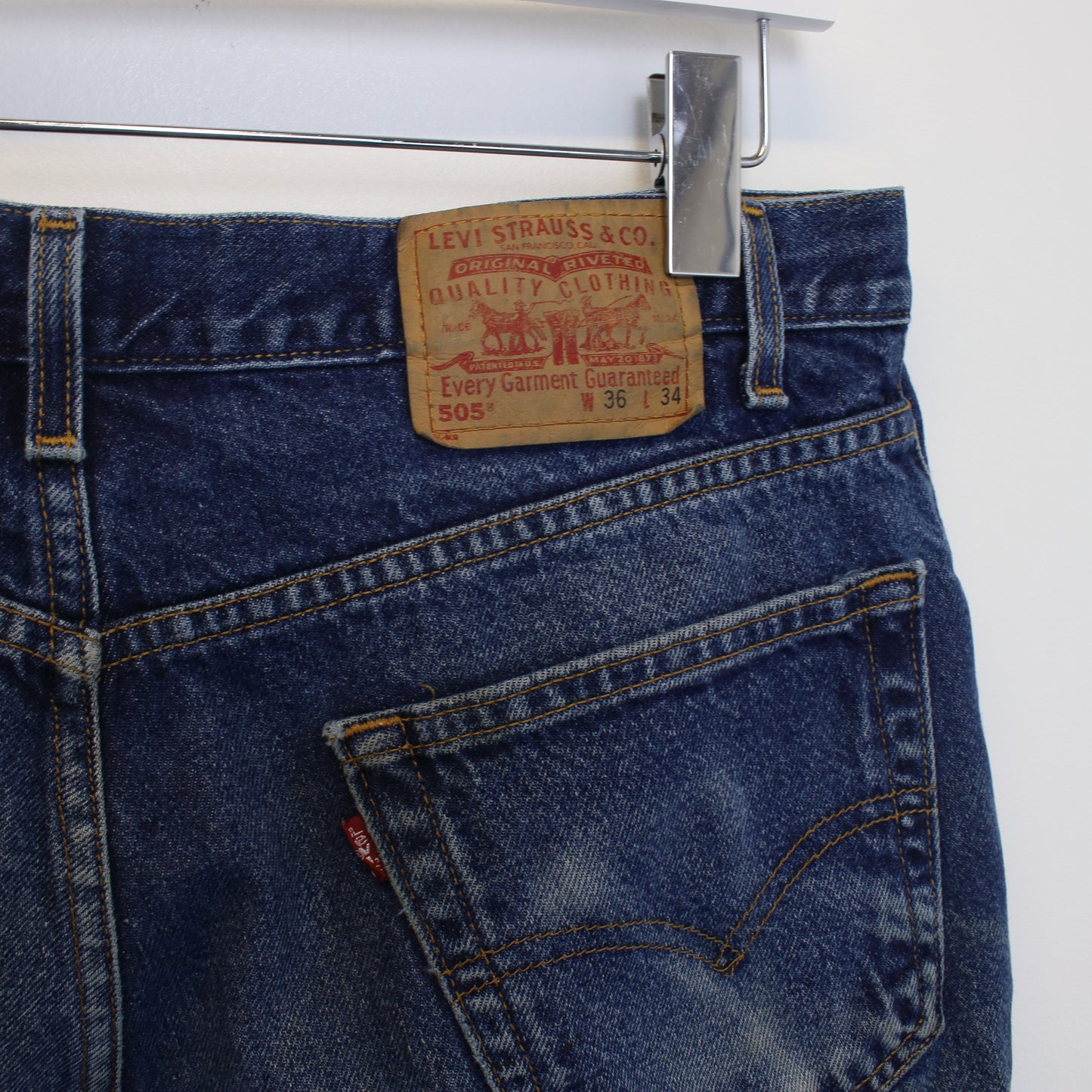 Vintage Levi's denim cut off shorts in blue. Best fits W34