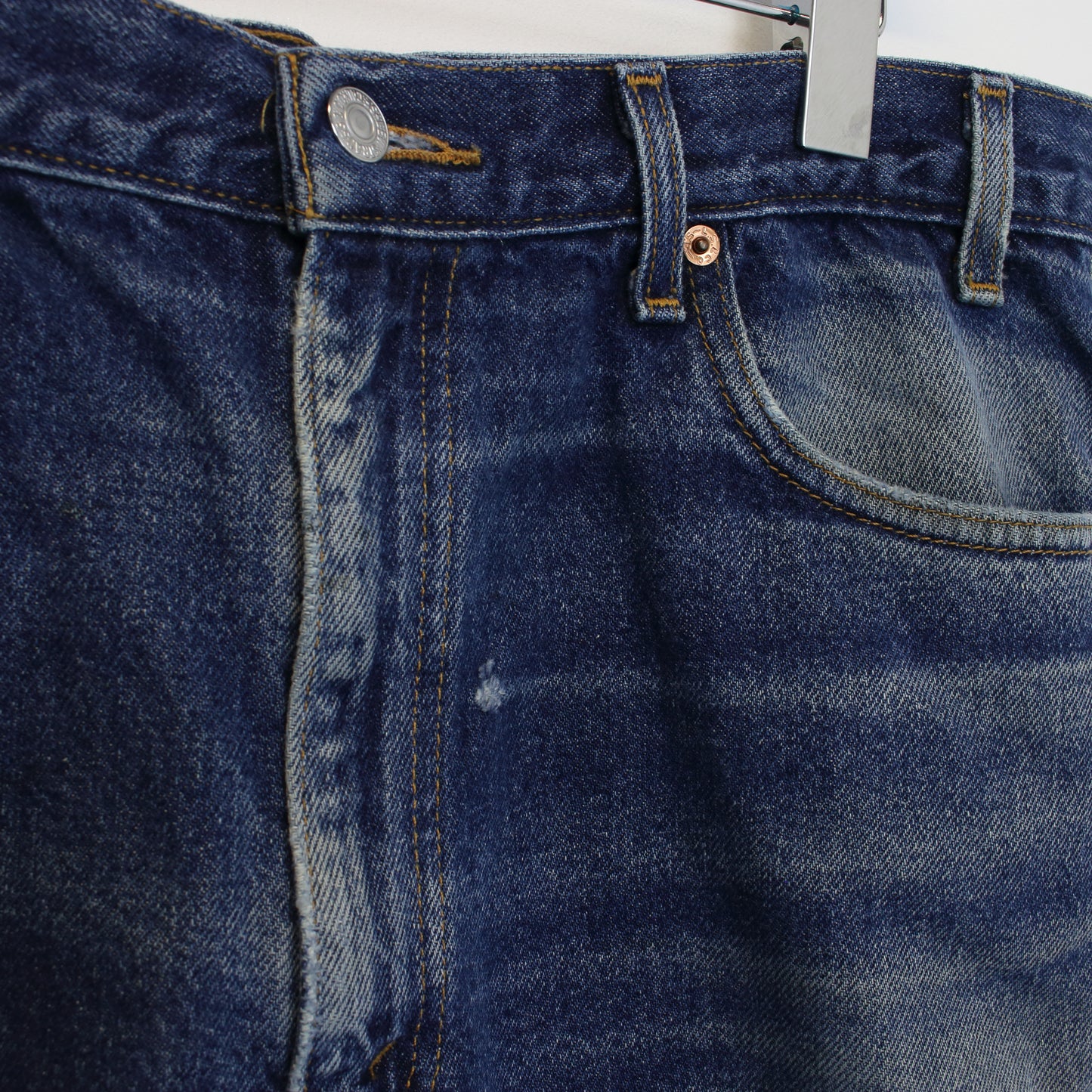 Vintage Levi's denim cut off shorts in blue. Best fits W34