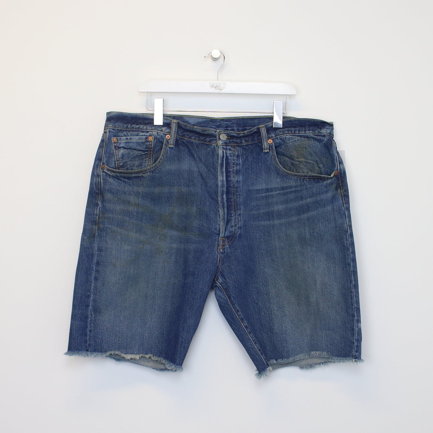 Vintage Levi's denim cut off shorts in blue. Best fits W40