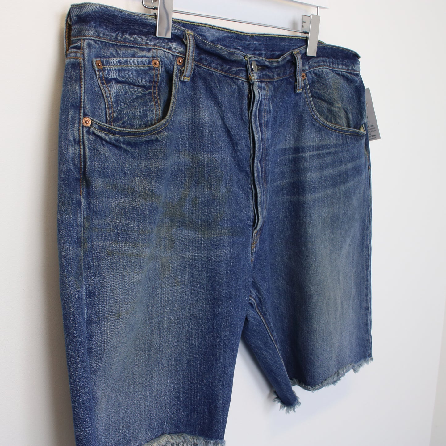 Vintage Levi's denim cut off shorts in blue. Best fits W40