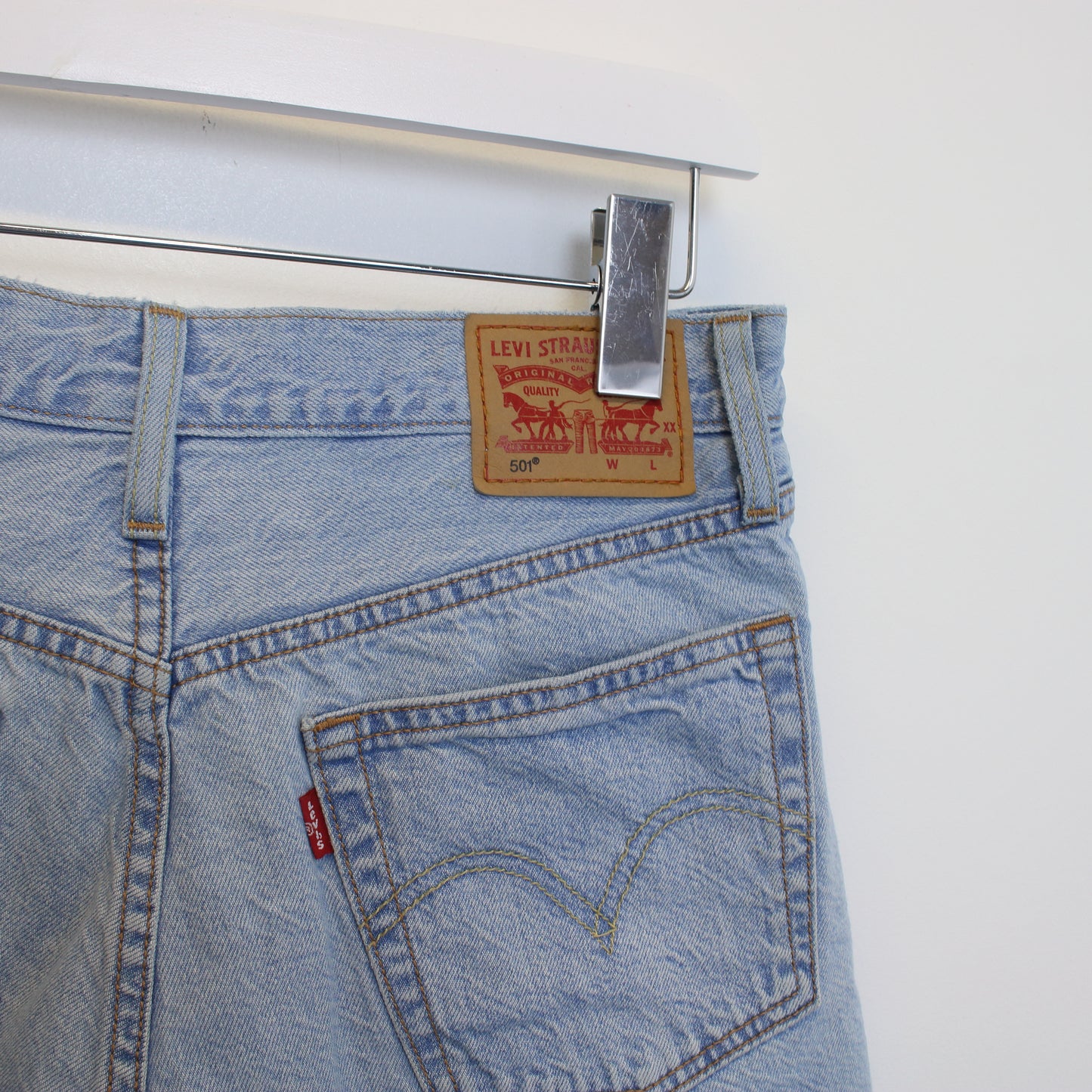 Vintage Women's Levi's denim cut off shorts in blue. Best fits W29