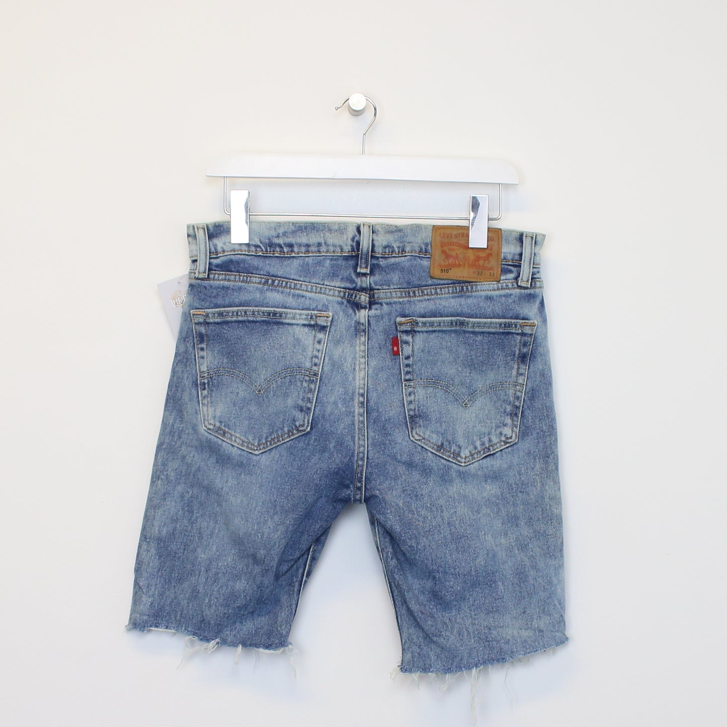 Vintage Levi's denim cut off shorts in blue. Best fits W31