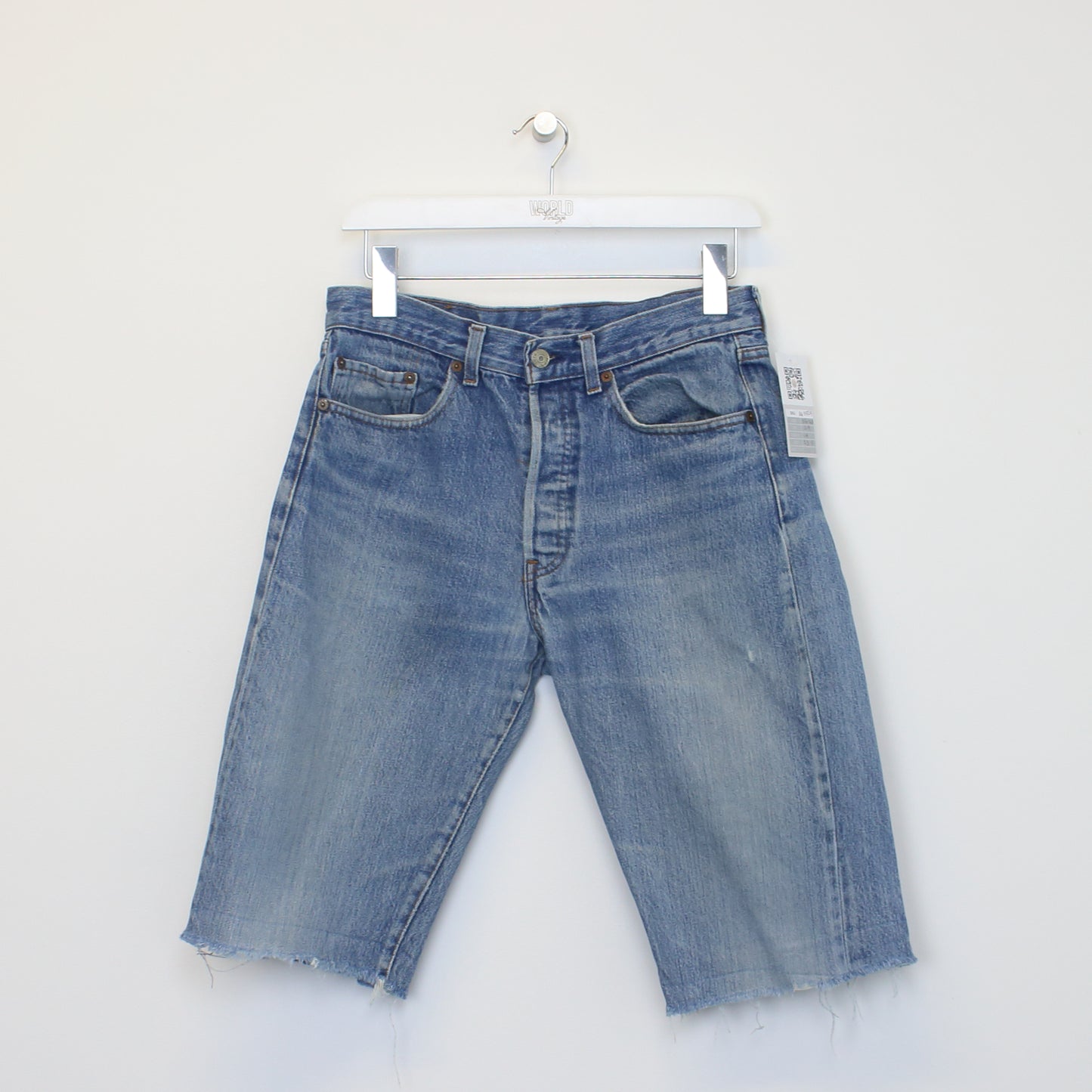 Vintage Levi's denim cut off shorts in blue. Best fits W29