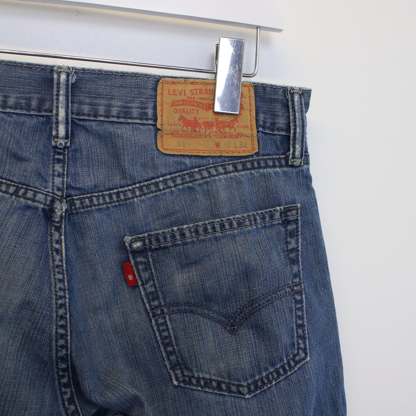 Vintage Levi's denim cut off shorts in blue. Best fits W30