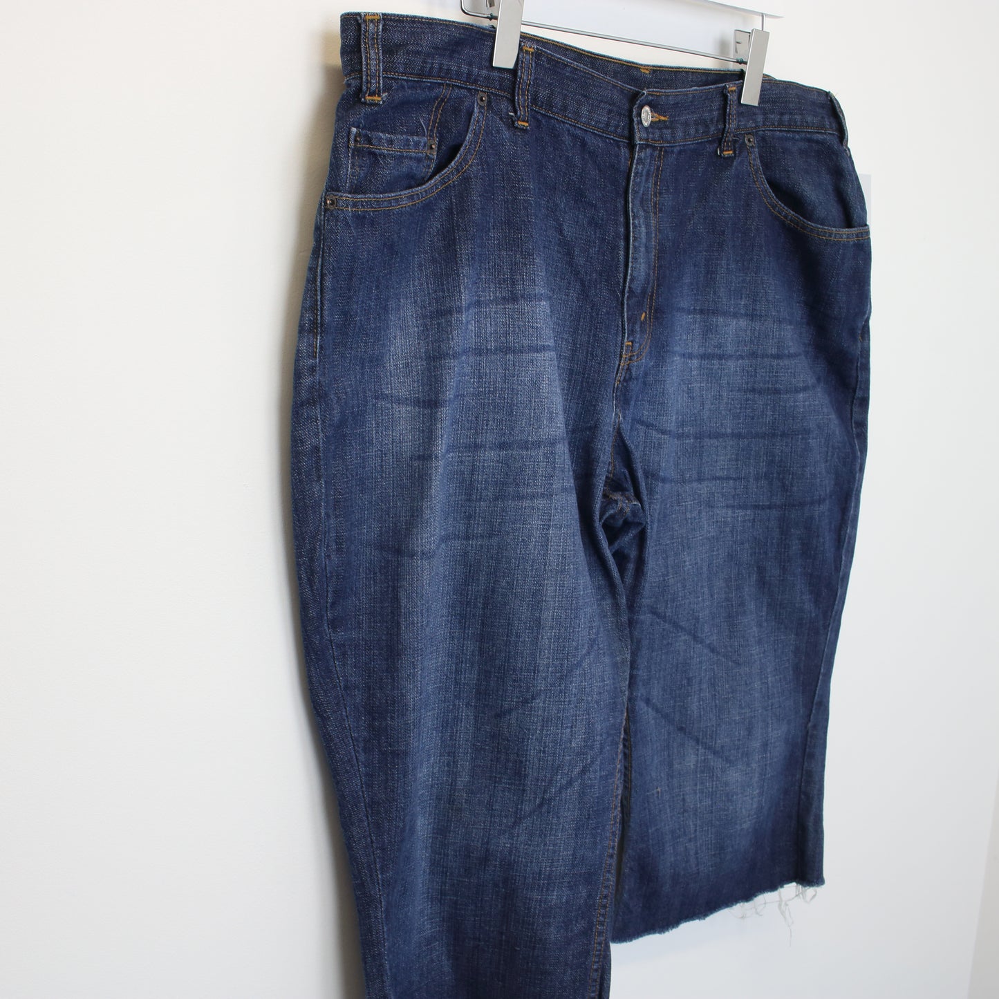 Vintage Levi's cut off denim shorts in blue. Best fits W41