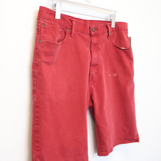 Vintage Levi's jean shorts in Red. Best fits W36