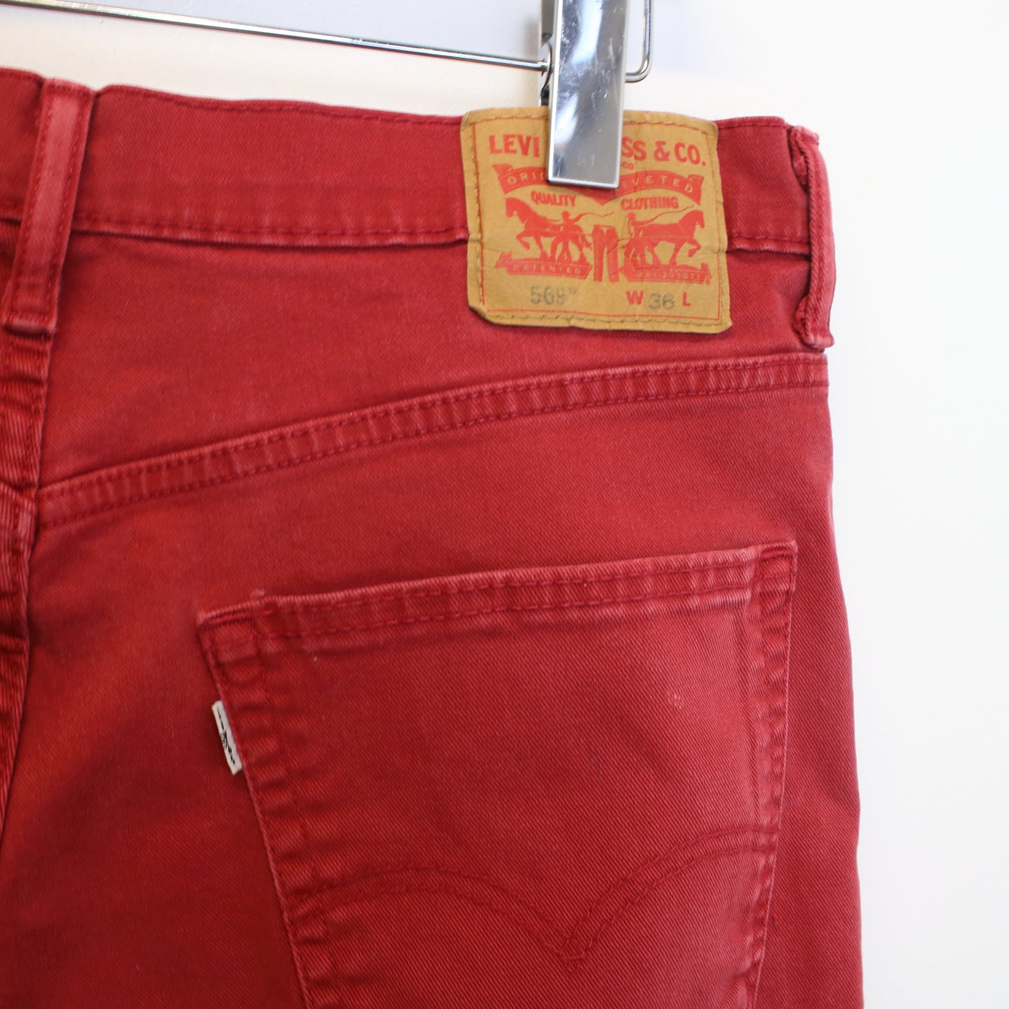 Vintage Levi's jean shorts in Red. Best fits W36