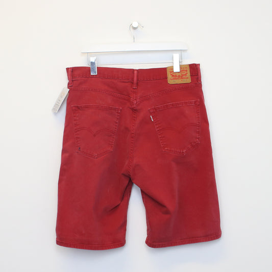 Vintage Levi's jean shorts in Red. Best fits W36