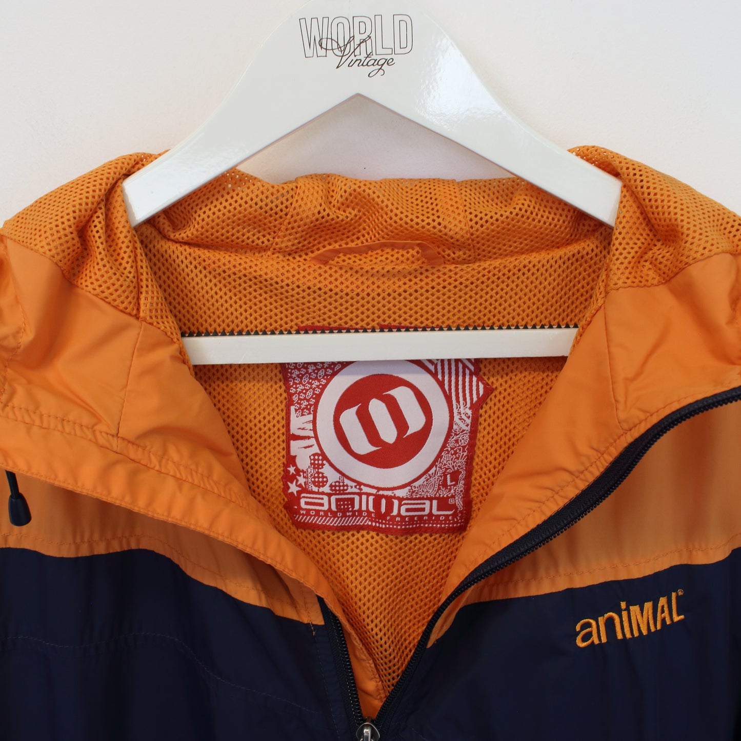 Vintage Animal jacket in orange & navy. Best fits L