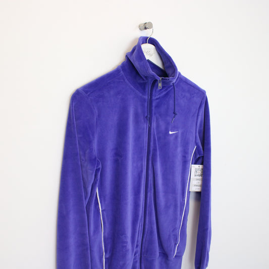 Vintage Womens Nike jacket in blue. Best fits L