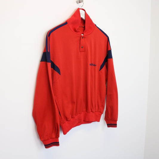Vintage Adidas jacket in red. Best fits S