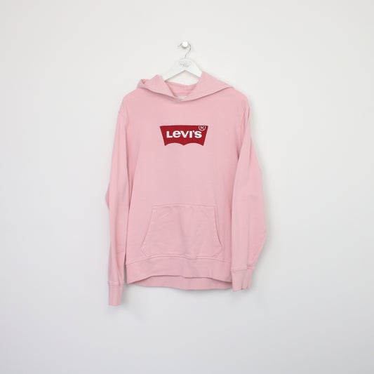 Vintage Levi's hoodie in pink. Best fits L