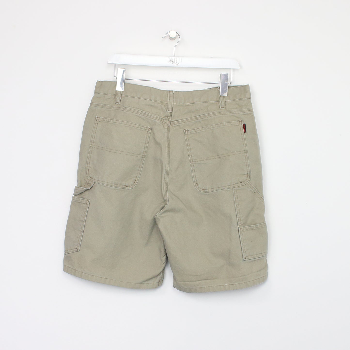 Vintage Levi's Cargo shorts in beige. Best fits W38