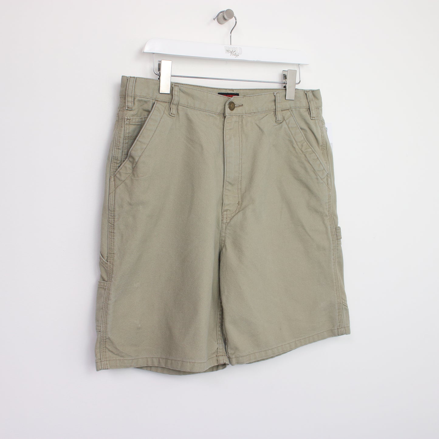 Vintage Levi's Cargo shorts in beige. Best fits W38