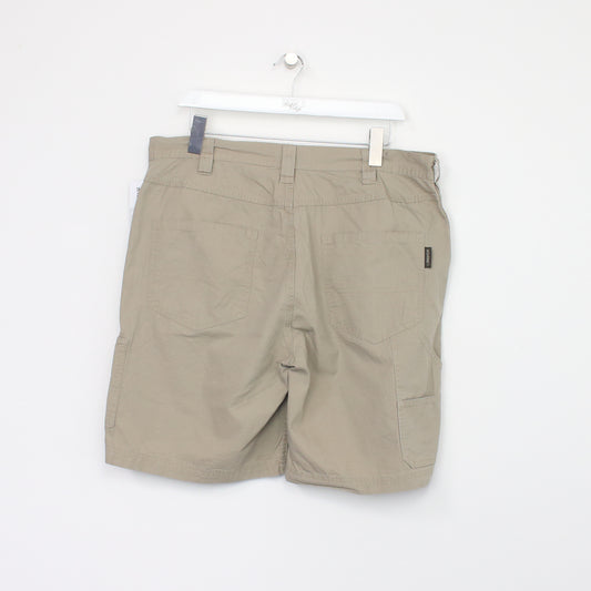 Vintage Wolverine Cargo shorts in beige. Best fits W36