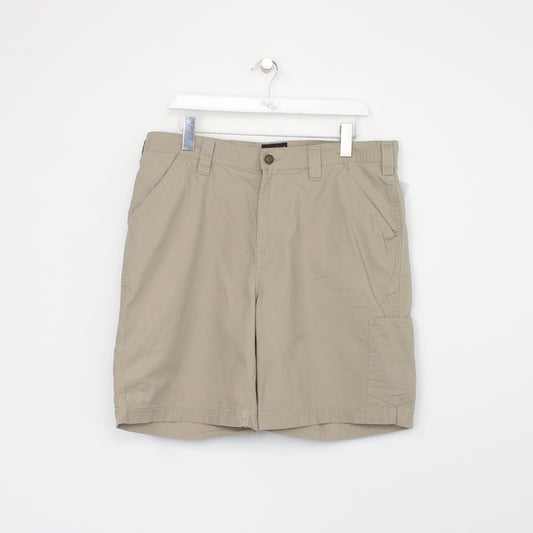 Vintage Wolverine Cargo shorts in beige. Best fits W36