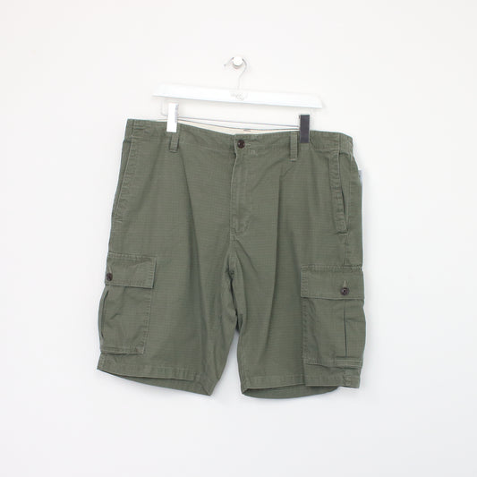 Vintage Dockers Cargo shorts in green. Best fits W38