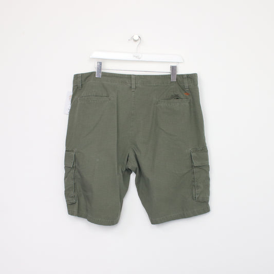 Vintage Dockers Cargo shorts in green. Best fits W38