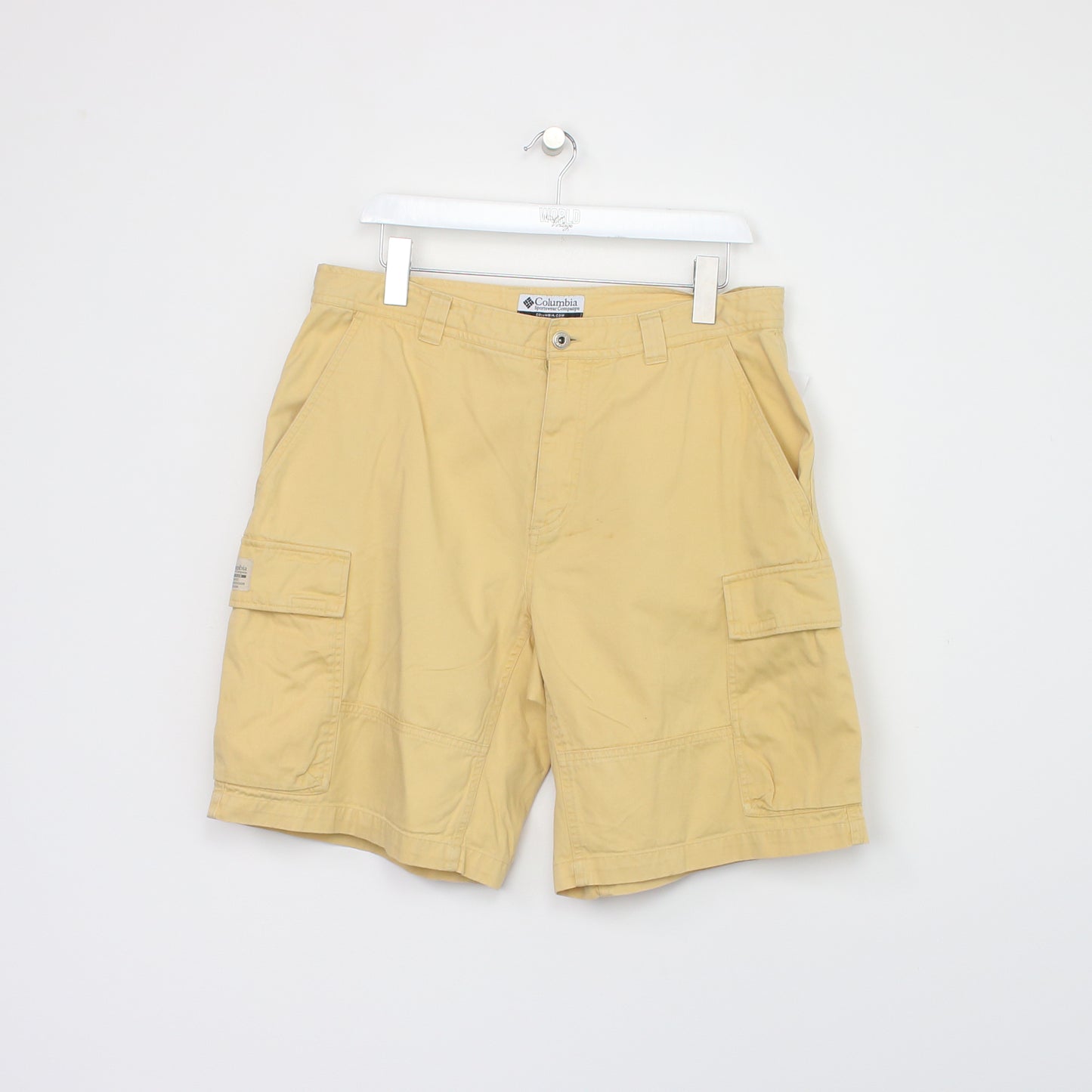 Vintage Columbia Cargo shorts in yellow. Best fits W34