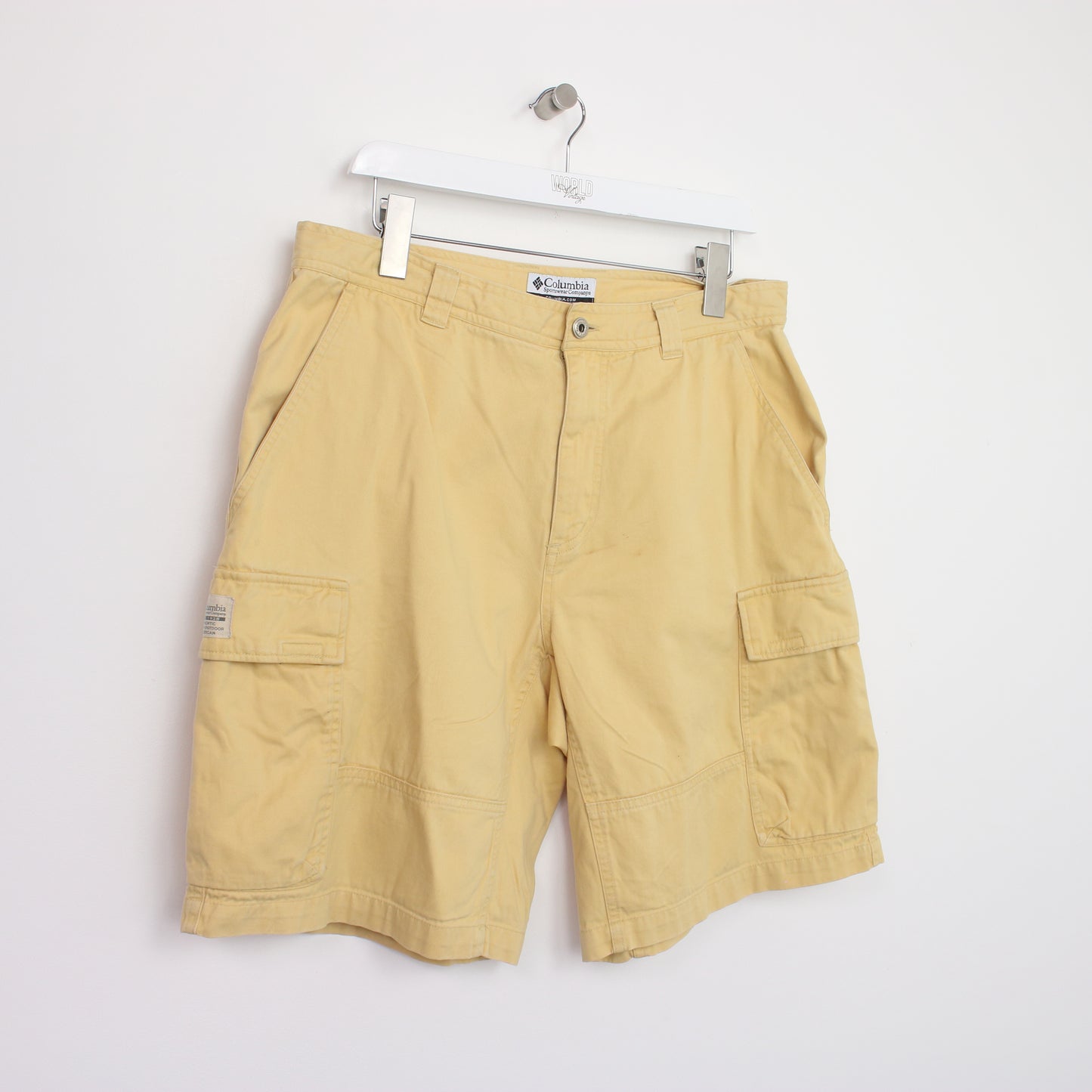 Vintage Columbia Cargo shorts in yellow. Best fits W34