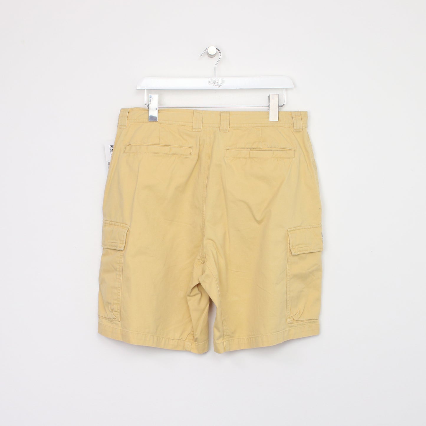 Vintage Columbia Cargo shorts in yellow. Best fits W34