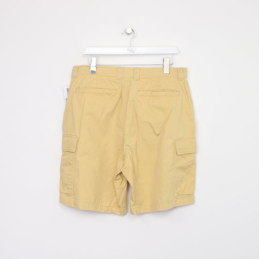 Vintage Columbia Cargo shorts in yellow. Best fits W34